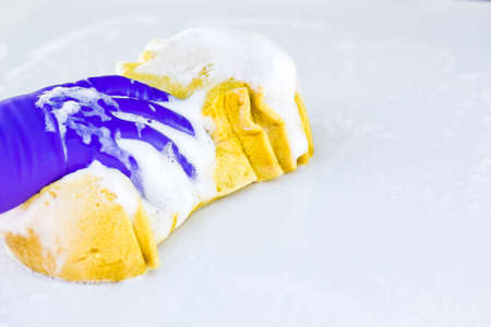 Male hands in gloves, car wash sponge.の写真素材