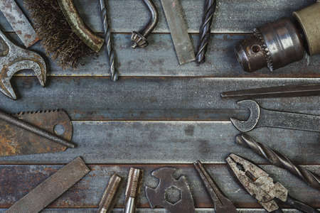 Old tool on rusty old metal slats. Copyspaceの写真素材