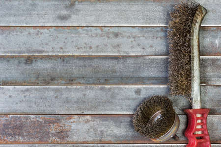 Wire brush for mechanical and machine cleaning of metal. Background image.の写真素材