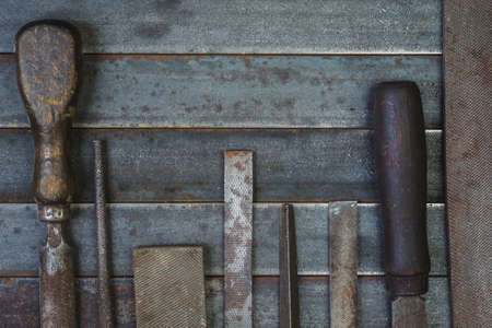 Set of various equipment, rasps for use in the hand with copy space, carpenter tool old rusty metal background.の写真素材