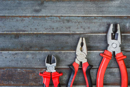 The pliers on a rusty old table. background, texture with copy space .の写真素材