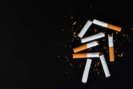 Cigarettes, tobacco, close-up on a black background.の写真素材