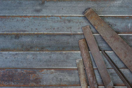 Set of various equipment, rasps for use in the hand with copy space, carpenter tool old rusty metal background.の写真素材