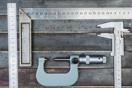 Measuring tools, metal background. Background, texture.