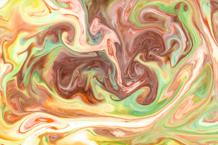 Artistic abstract design created with mixing color liquids. Colorful background texture. Liquids mixing on water surface.の写真素材