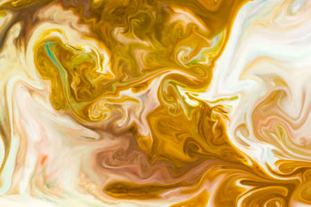 Artistic abstract design created with mixing color liquids. Colorful background texture. Liquids mixing on water surface.の写真素材