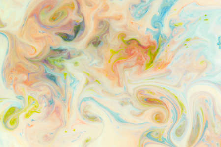 Artistic abstract design created with mixing color liquids. Colorful background texture. Liquids mixing on water surface.の写真素材