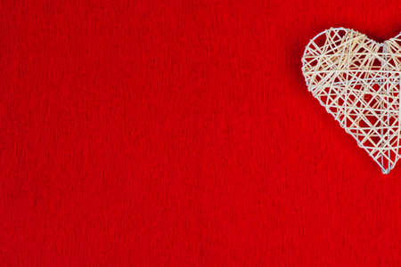 Woven heart on a red corrugated paper.の写真素材