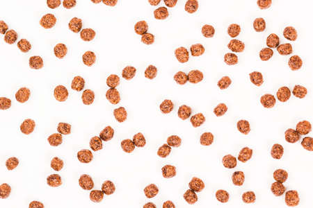 Chocolate breakfast. Cereal balls as background. Chocolate corn balls .の写真素材
