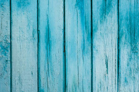 Blue plaque-wall of the old barn. Textured and peeling blue paint from old farm building. Background, texture.の写真素材