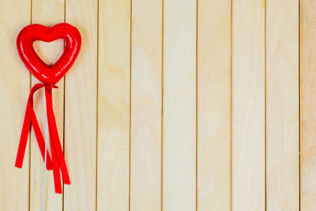 Heart on a wooden table. backgroundの写真素材