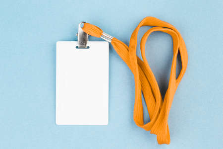 Empty ID card / icon with an orange belt, on a blue background. Space for text.