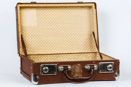 A brown suitcase. Vintage luggage. Vintage travel bag. Isolated on white background.の写真素材