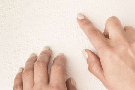 Books Braille. The touch of your fingertips the texture of the paper, reading the sign. Reading the...