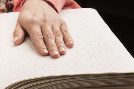 Books Braille. The touch of your fingertips the texture of the paper, reading the sign. Reading the...