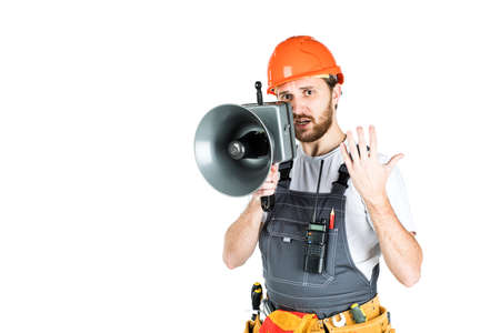 A man builder says through a megaphone. isolated on white background.の写真素材