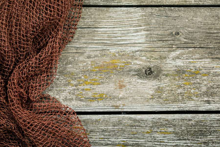 Hanging network on a wooden wall. background image.の写真素材