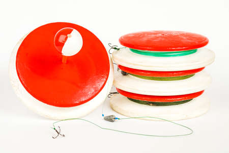 Fishing supplies handmade. Round spools for Fishing. Fishing accessories on a white background.の写真素材