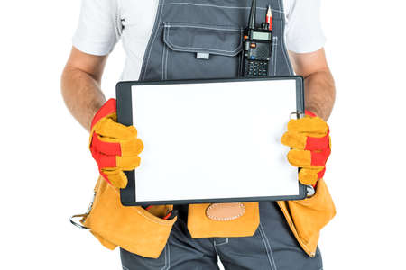 A construction man showing a clean sheet of paper to the clipboard. isolated on white background.