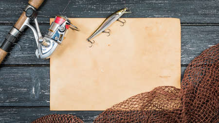 Fishing gear - fishing, hooks and baits, a wooden background.の写真素材