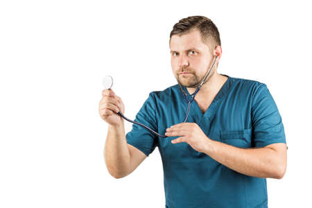 Portrait of a doctor using his stethoscope. Isolated on white background.