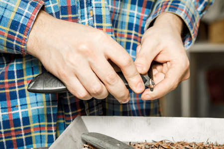 Sharpening a pencil with a stationery knifeの写真素材