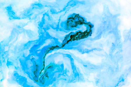 Coloring ink flowing and mixing in milk texture. background image.