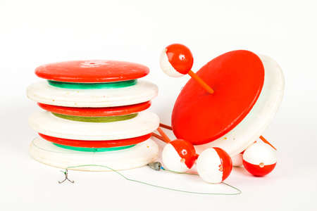Fishing supplies handmade. Round spools for Fishing. Fishing accessories on a white background.の写真素材