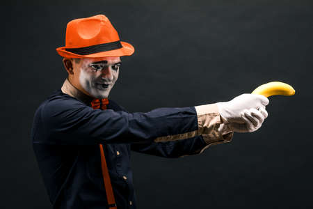 Portrait of MIM in the form of a criminal, a bandit. Race of bandits. Keep the banana in the form of weapons .の写真素材