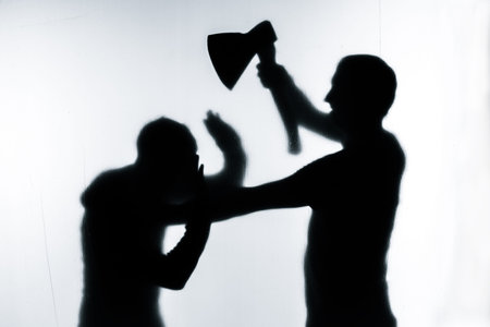 Self-defense battle silhouette. A man fights against an aggressor with a knife. Fight for life...