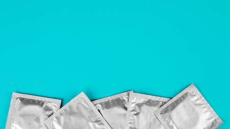 Condom on a blue background. The concept of safe sexの写真素材