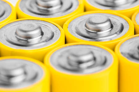 AA alkaline batteries on white backgroundの写真素材