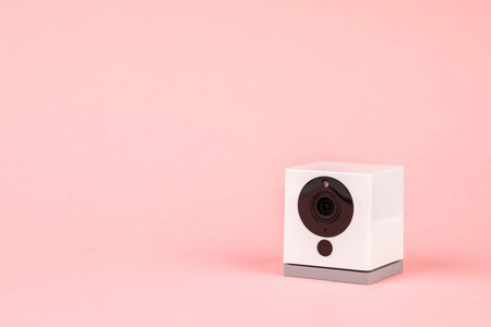 white webcam on pink background, object, Internet, technology concept.