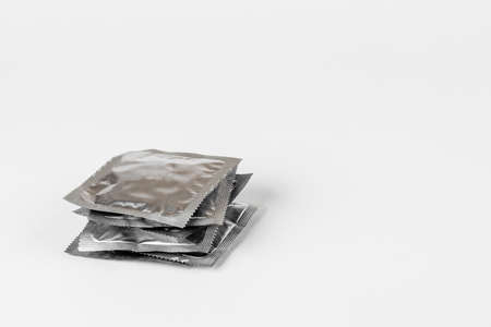Background of condoms. condoms on a white background.の写真素材