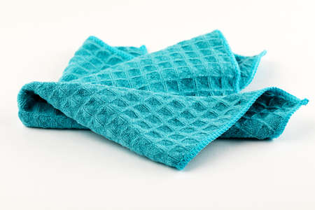 Clean blue kitchen towel on white background