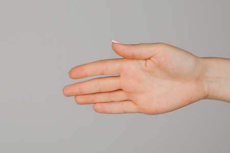 Female hand on white backgroundの写真素材