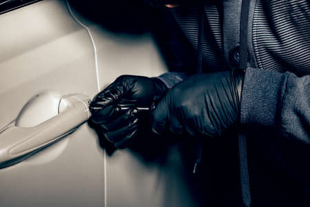 A man with a Balaclava on his head tried to break into the car. He uses a screwdriver. Hijacker, the...