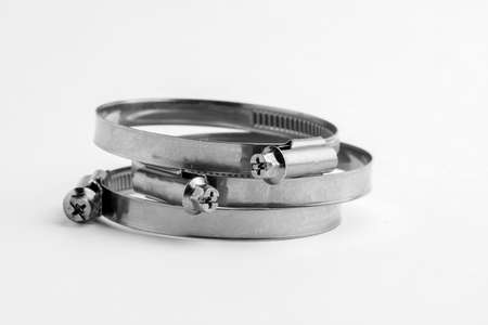 Different metal clamps for hose connection isolated on white background close up.の写真素材