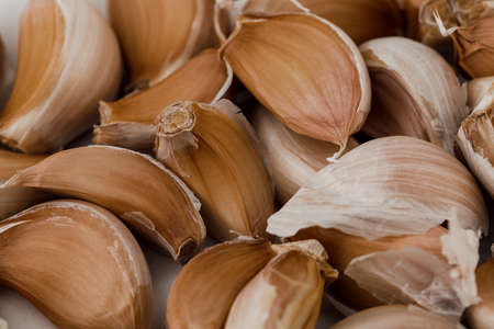 Fresh garlic cloves, top view. Food background, texture.