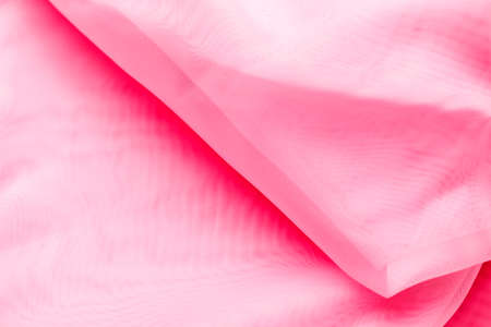 Pink textural crumpled fabric.