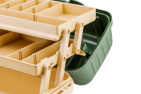 Open fishing tackle box on white background.