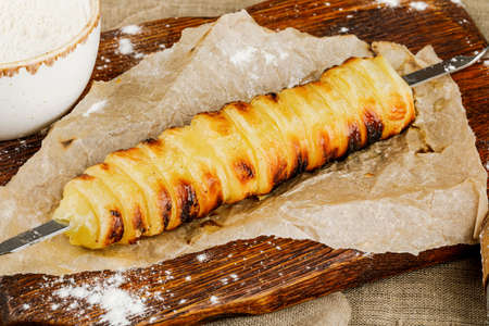 homemade trdelnik with kitchenware on wooden tray.の写真素材