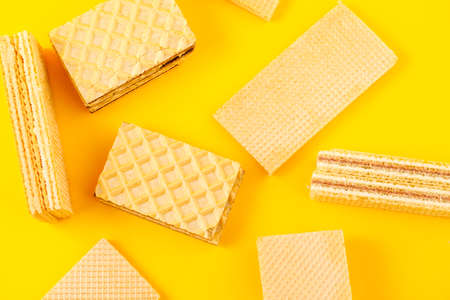 Crispy waffle sticks on a yellow background.の写真素材