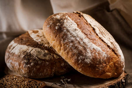 Bread on a cutting Board. Whole-grain rye bread.の写真素材