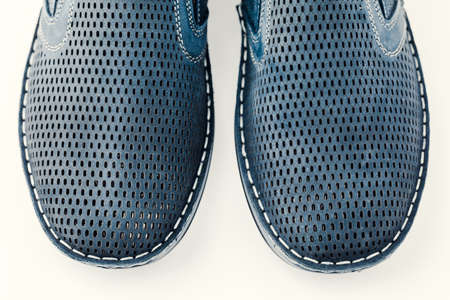Men's blue shoes on a white isolated background.の写真素材