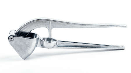 garlic squeezer isolated on white background.の写真素材