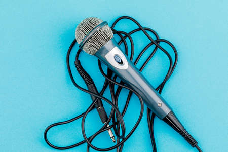 Vocal audio microphone on a blue background