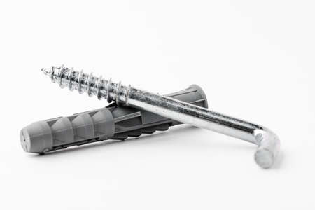 Metal hooks screws isolated on a white background. Concept of repair and construction.の写真素材