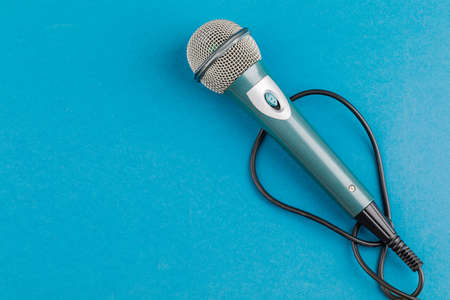 Vocal audio microphone on a blue backgroundの写真素材