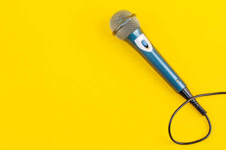 Acoustic microphone on a yellow background. The view from the top.の写真素材
